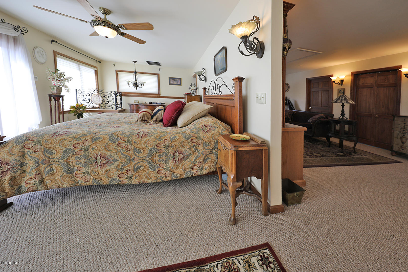 142 Kibbe Road Otis, MA 01029 - Photo 19 of 28 a bed room with a bed and a chair