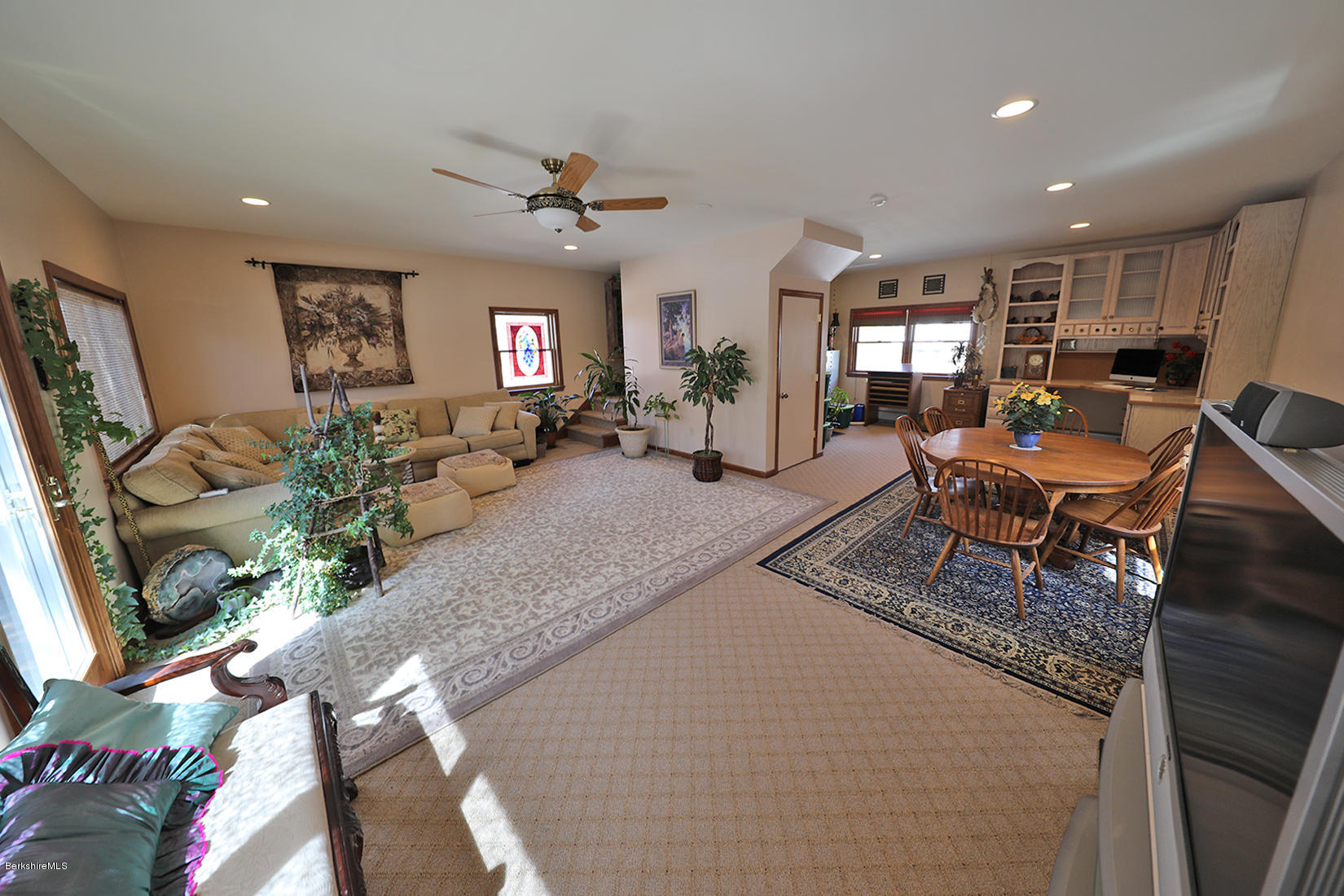 142 Kibbe Road Otis, MA 01029 - Photo 20 of 28 a living room with furniture a large window and potted plant