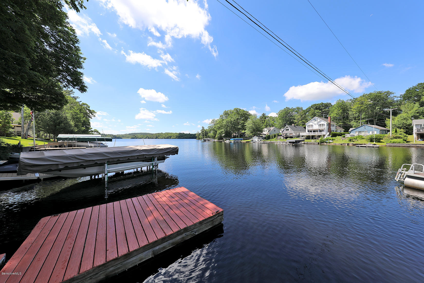 142 Kibbe Road Otis, MA 01029 - Photo 27 of 28 a view of a patio with wooden floor and lake view