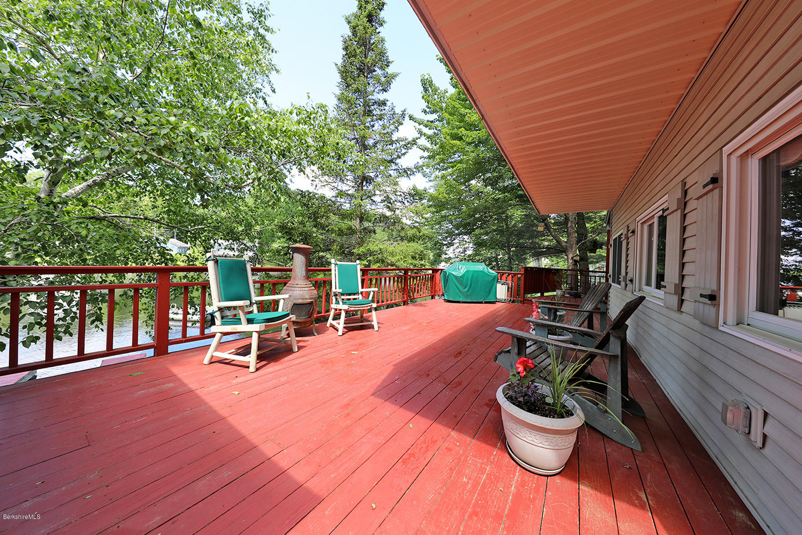 142 Kibbe Road Otis, MA 01029 - Photo 5 of 28 a view of a patio with a table chairs and a potted plant