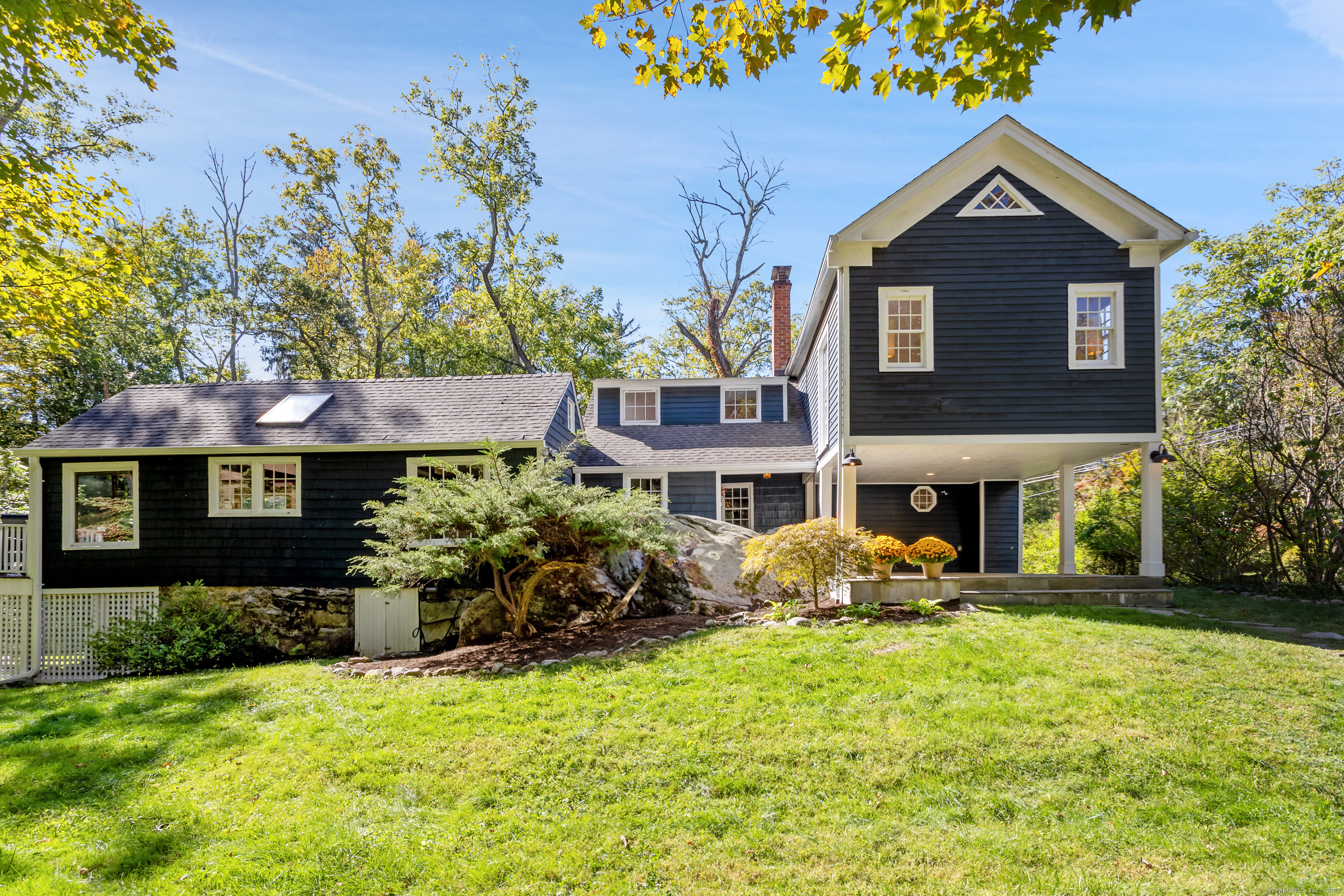 a front view of a house with garden