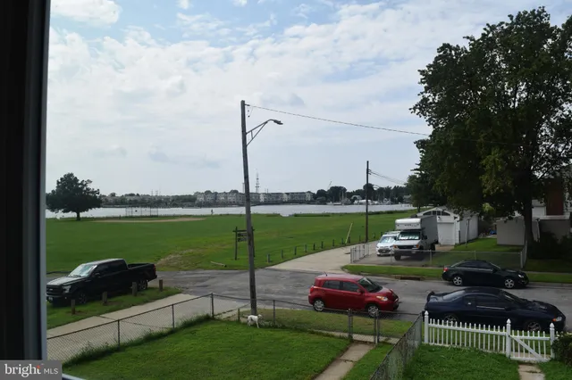 a view of a garden with lawn chairs