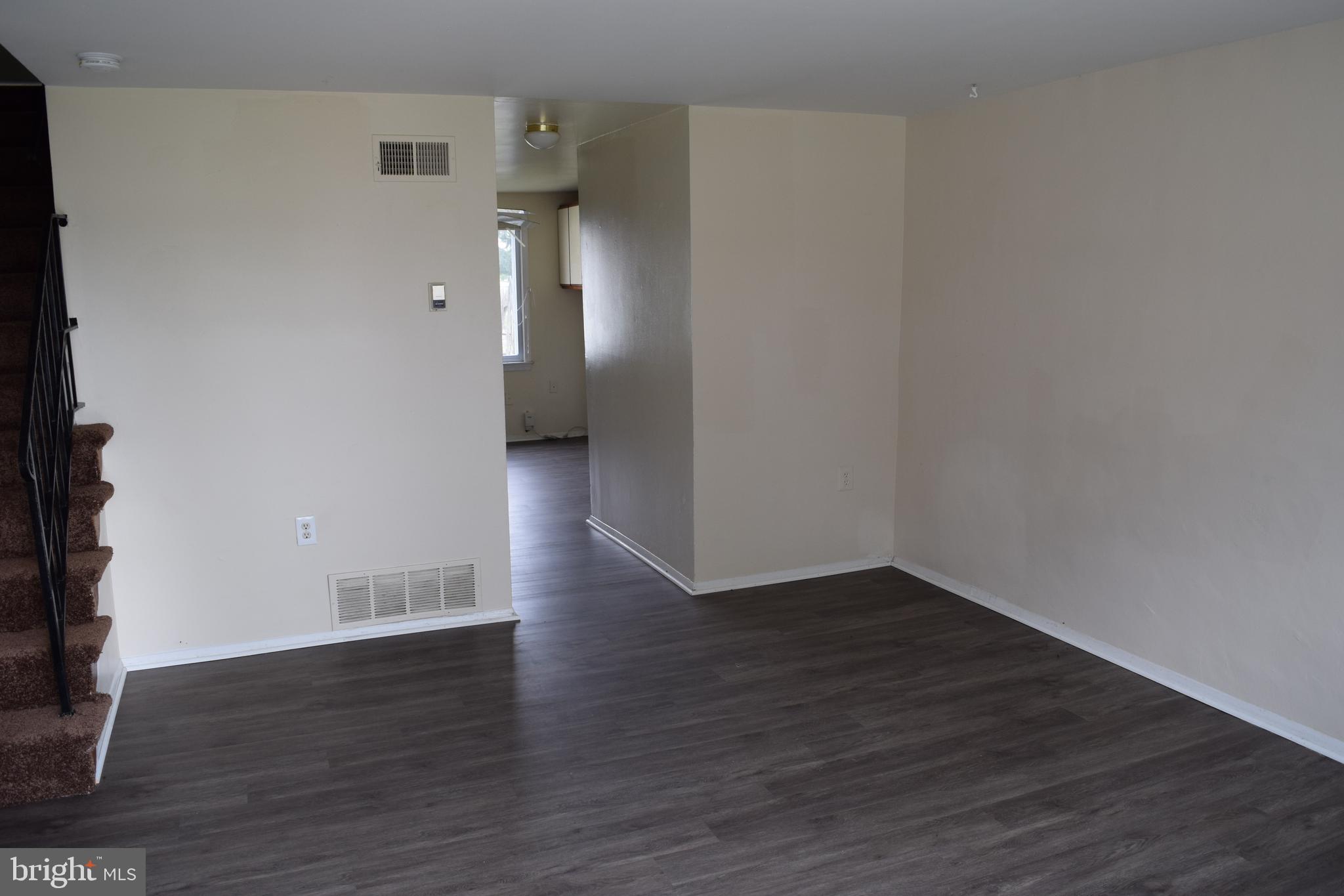 2111 Larkhall Road Baltimore, MD 21222 - Photo 2 of 13 a view of a room with wooden floor