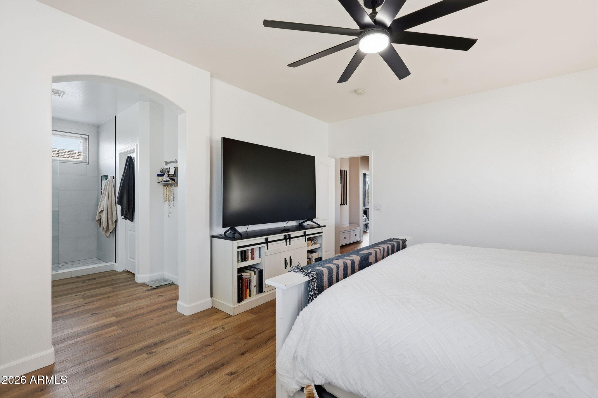 4184 East Trigger Way Gilbert, AZ 85297 - Photo 23 of 51 a bedroom with a bed and a flat screen tv