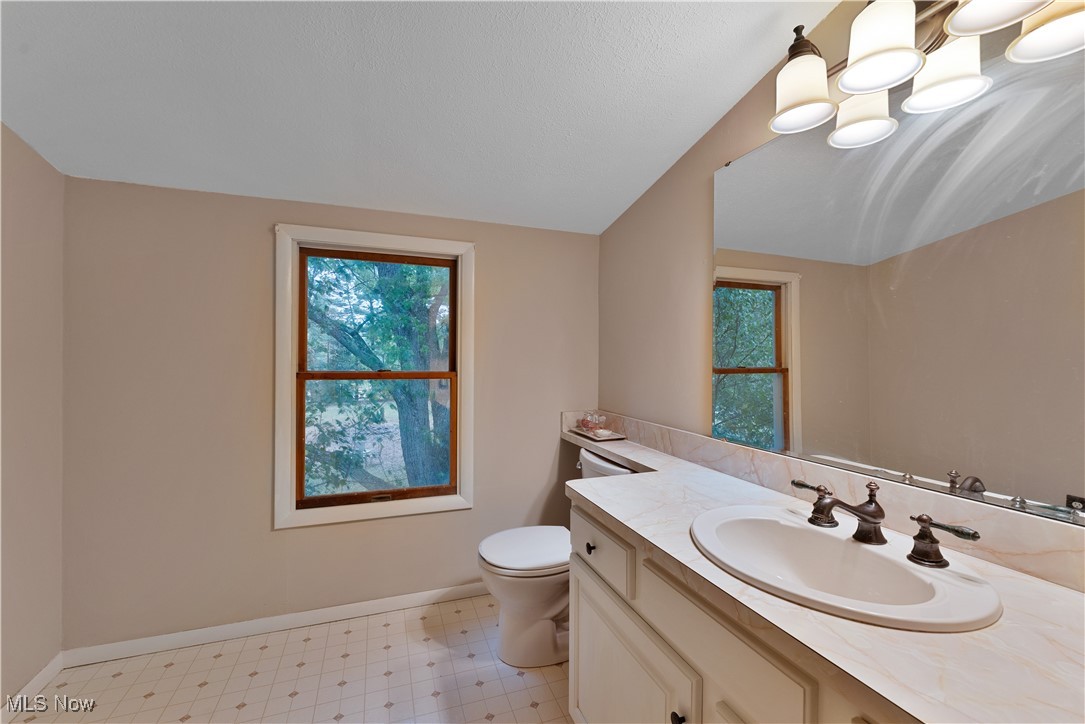 6370 Fairview Road Youngstown, OH 44515 - Photo 28 of 38 Upstairs full bathroom with vanity, vaulted ceiling, and light floors