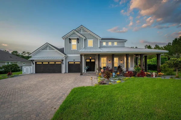 a front view of house with yard and outdoor seating
