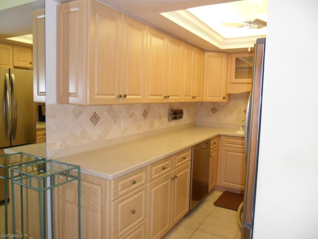159 Teryl Road, Unit E2 Naples, FL 34112 - Photo 4 of 16 plenty of cabinet and counter space