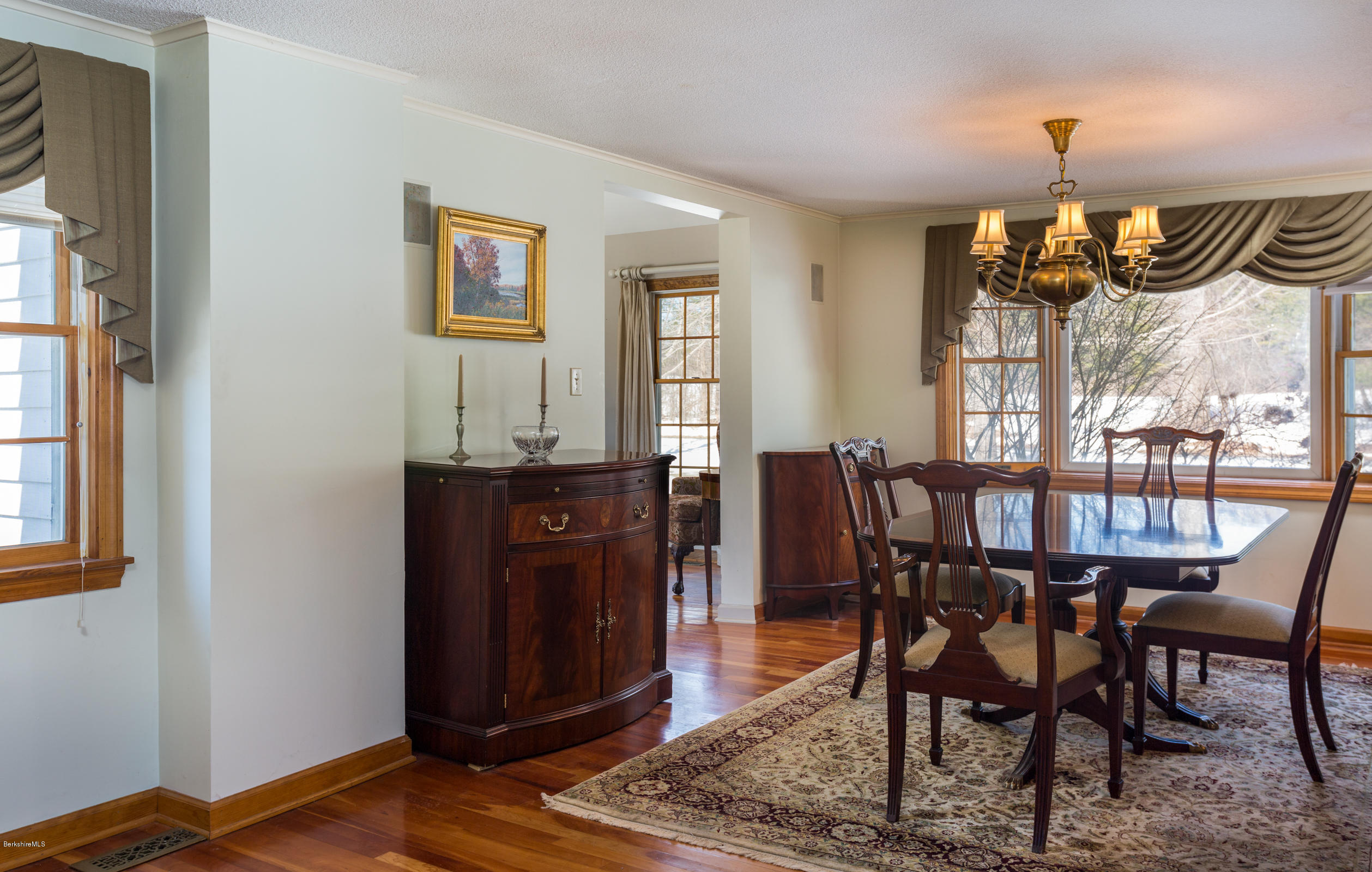 215 Devon Road Lee, MA 01238 - Photo 11 of 59 a view of a dining room with furniture window and wooden floor