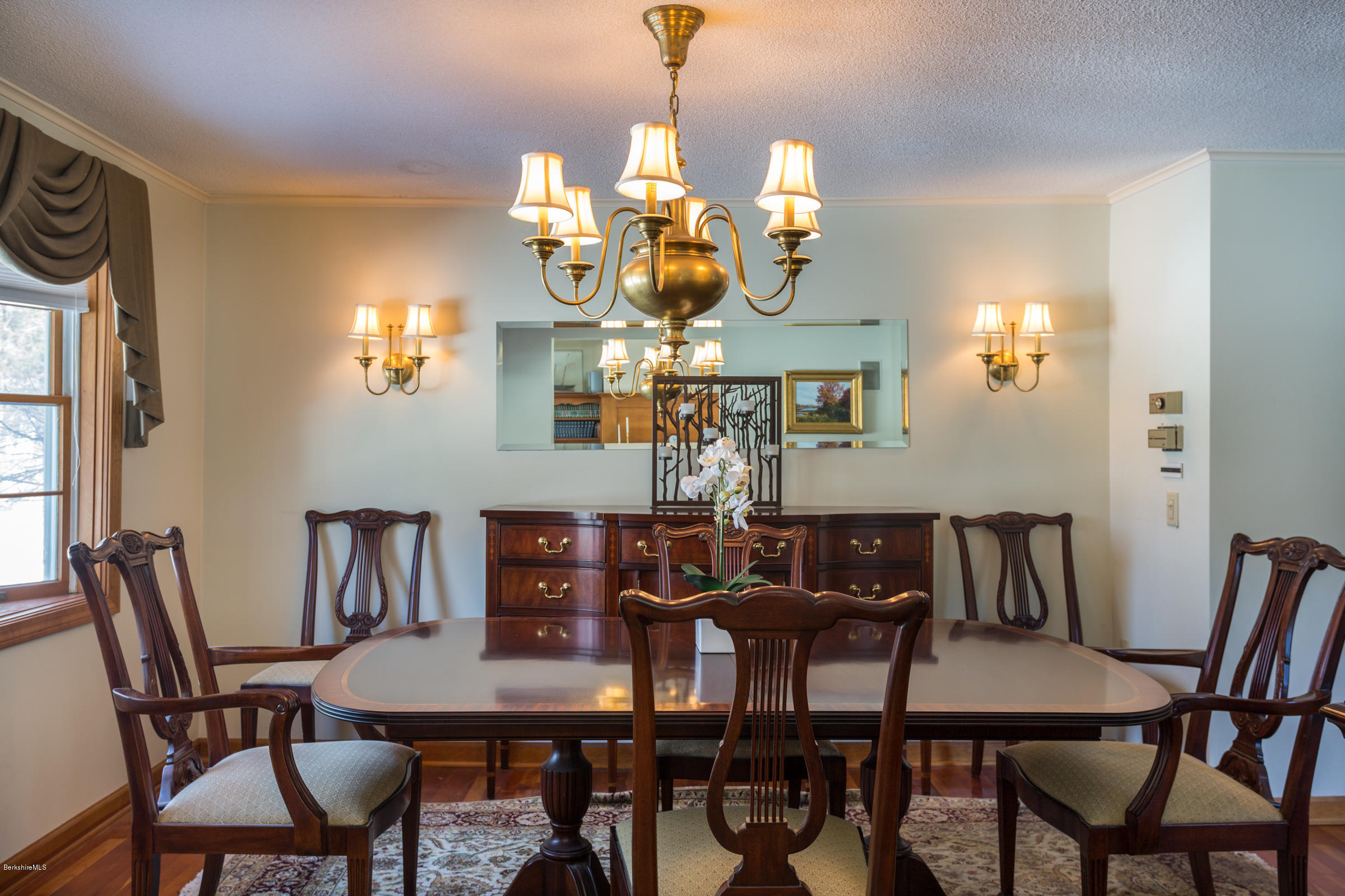 215 Devon Road Lee, MA 01238 - Photo 12 of 59 a view of a dining room with furniture and chandelier