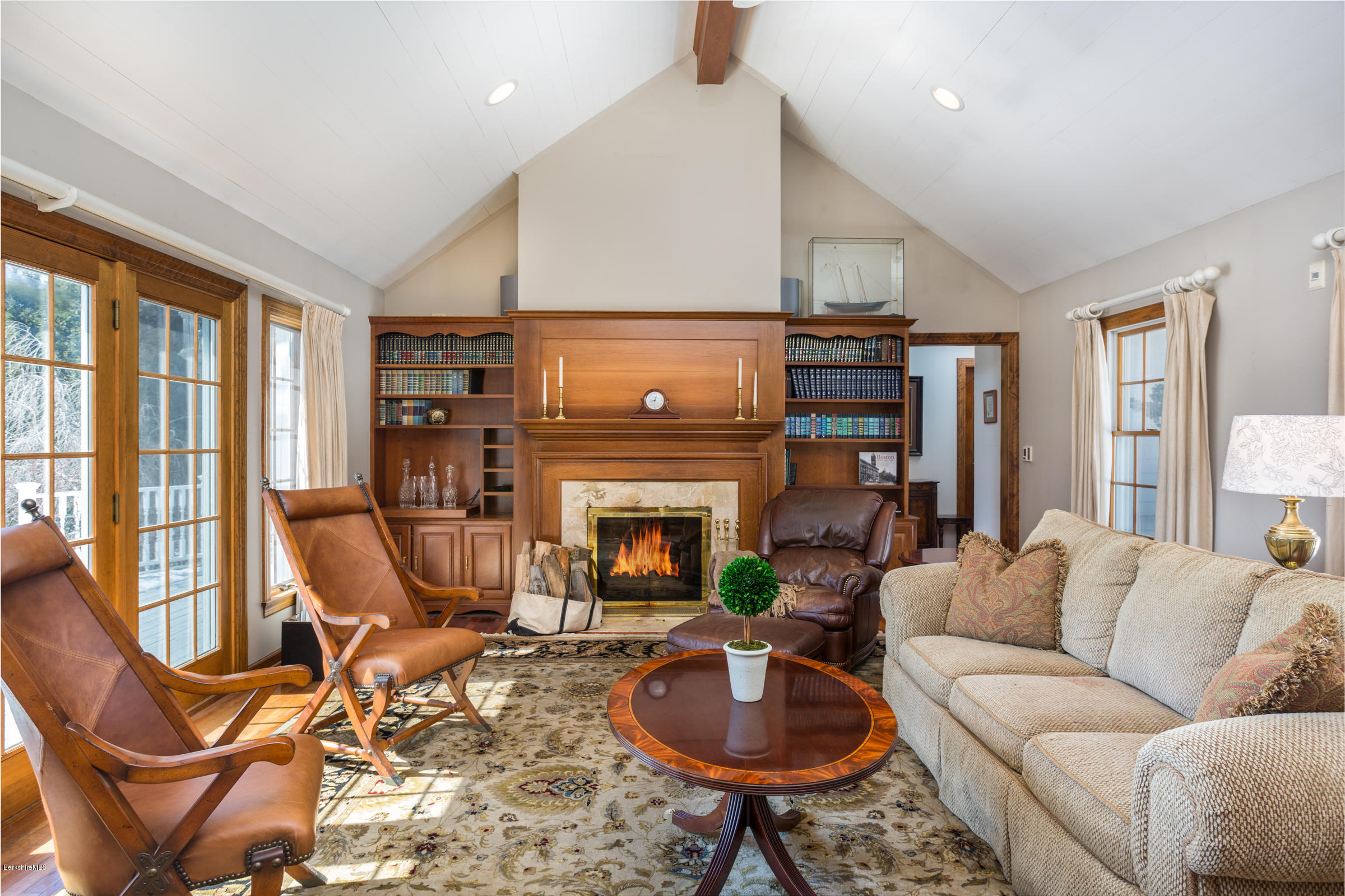 215 Devon Road Lee, MA 01238 - Photo 14 of 59 a living room with furniture a fireplace and a large window