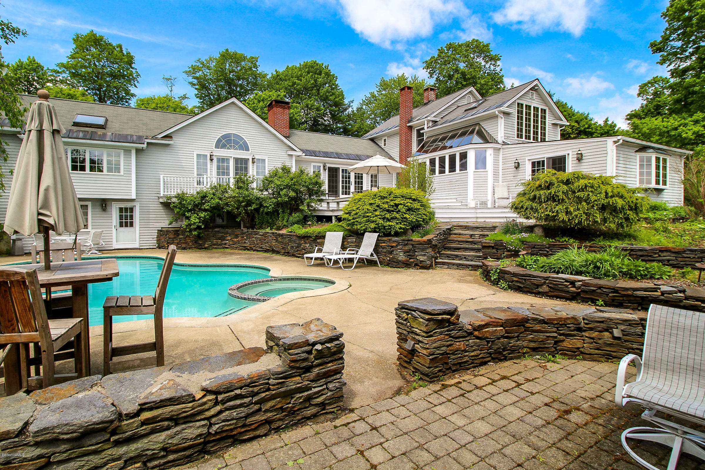 215 Devon Road Lee, MA 01238 - Photo 3 of 59 a view of a house with swimming pool and sitting area