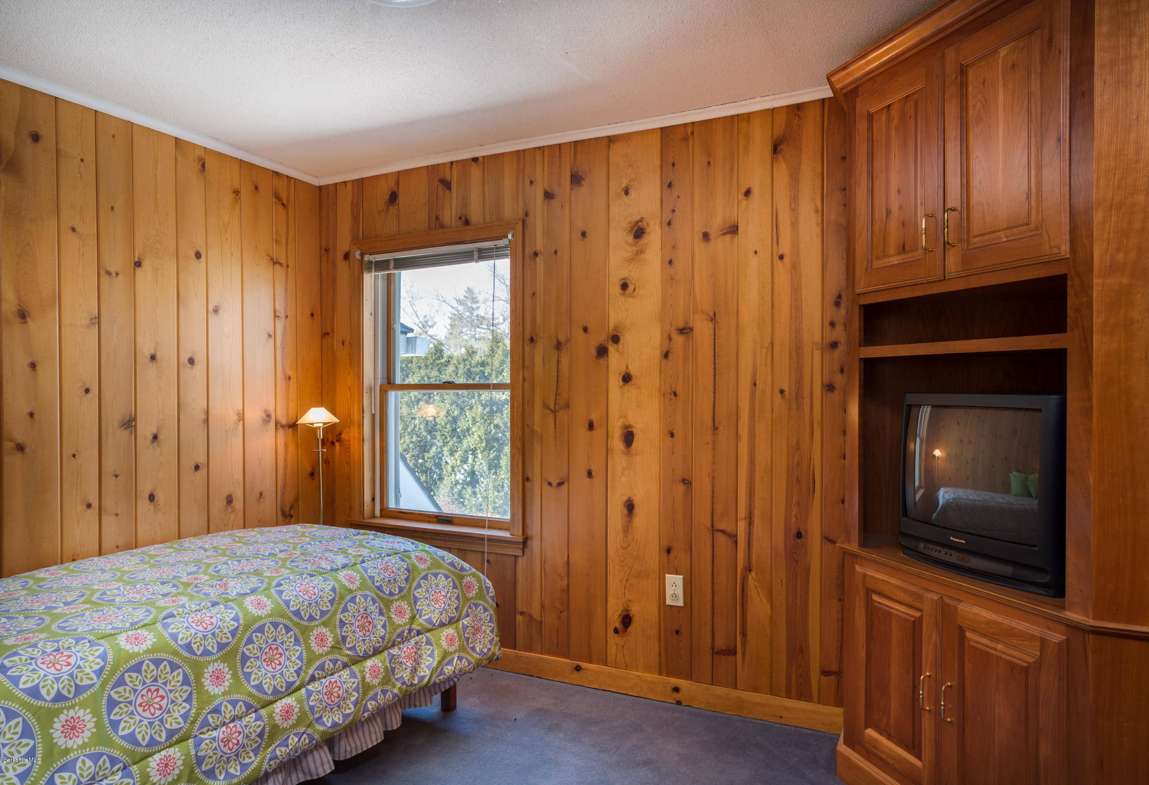 215 Devon Road Lee, MA 01238 - Photo 33 of 59 a bedroom with a bed and a tv