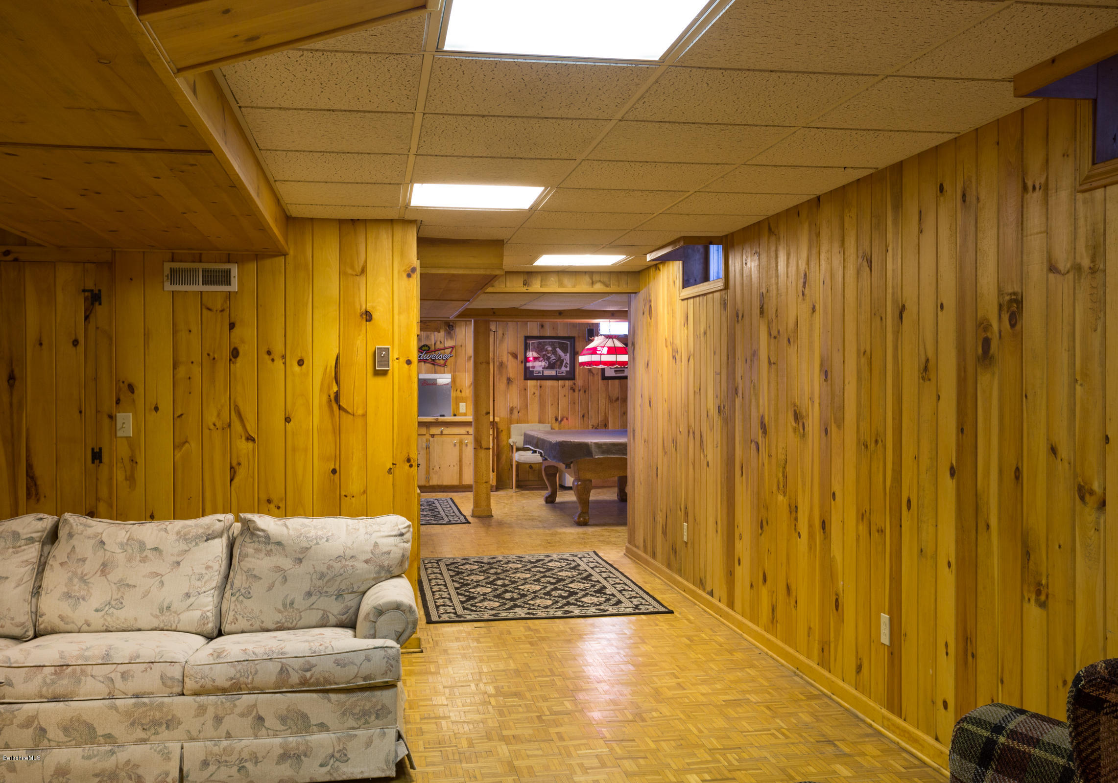 215 Devon Road Lee, MA 01238 - Photo 37 of 59 a living room with a couch and a table