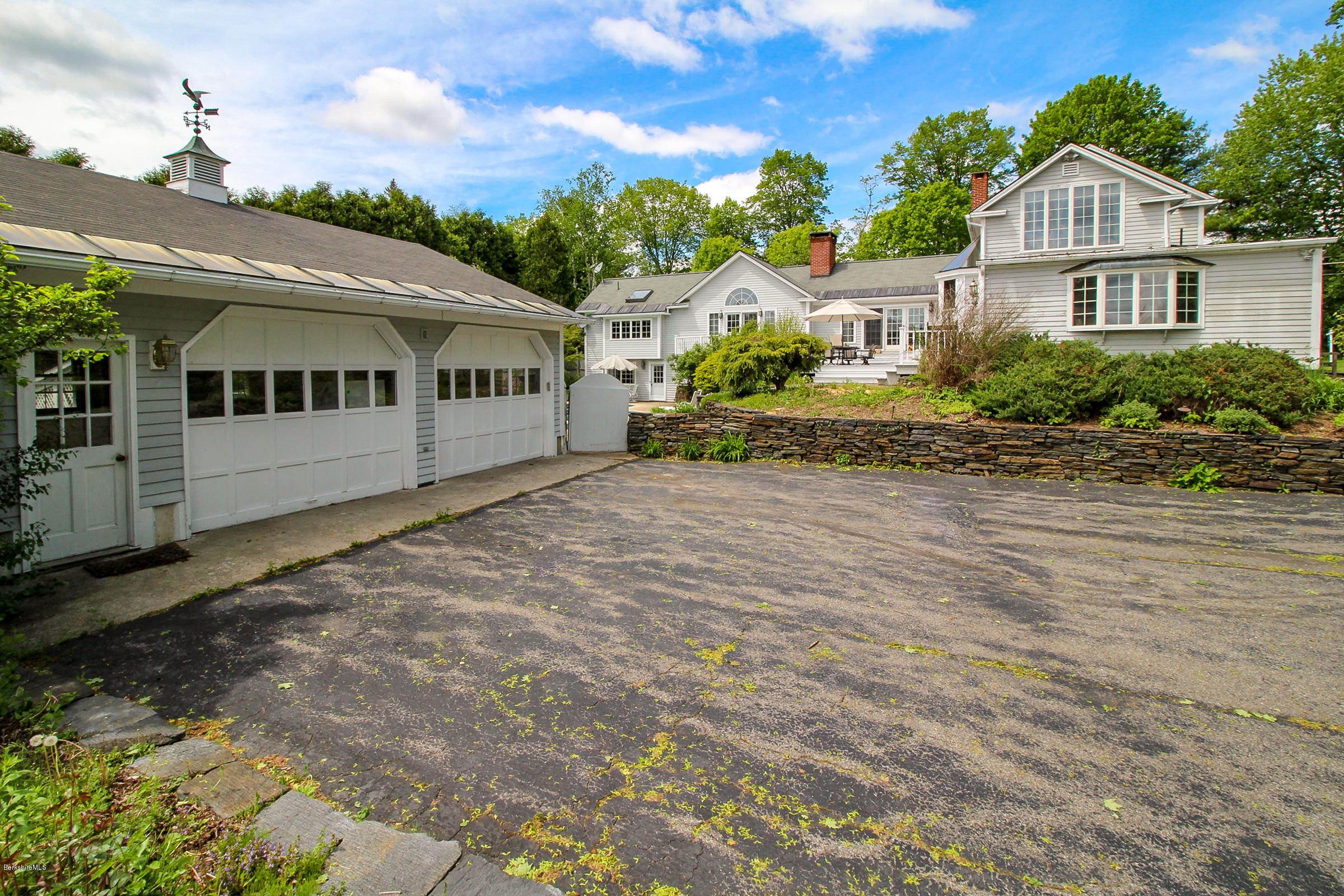 215 Devon Road Lee, MA 01238 - Photo 38 of 59 a front view of a house with a garden