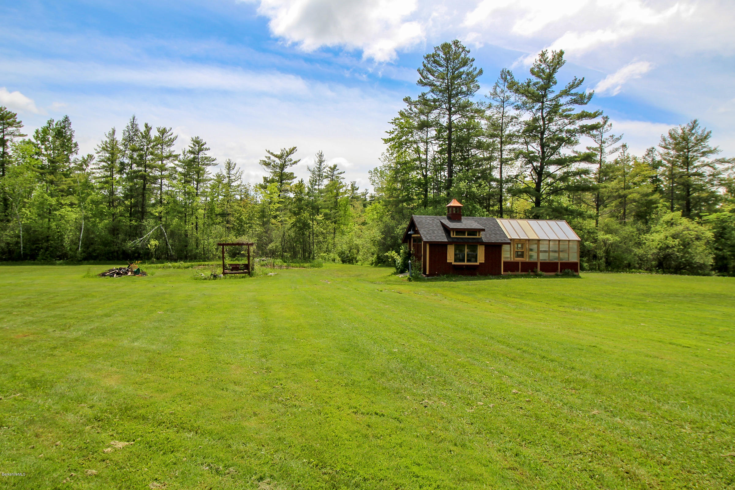 215 Devon Road Lee, MA 01238 - Photo 41 of 59 a front view of a house with a yard