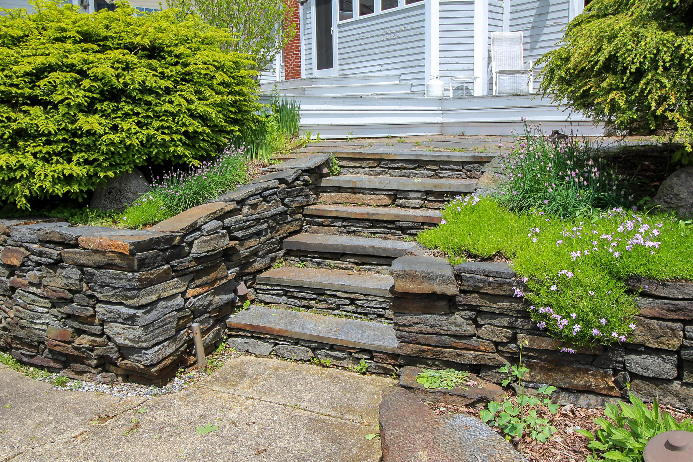 215 Devon Road Lee, MA 01238 - Photo 45 of 59 a view of a backyard with chairs