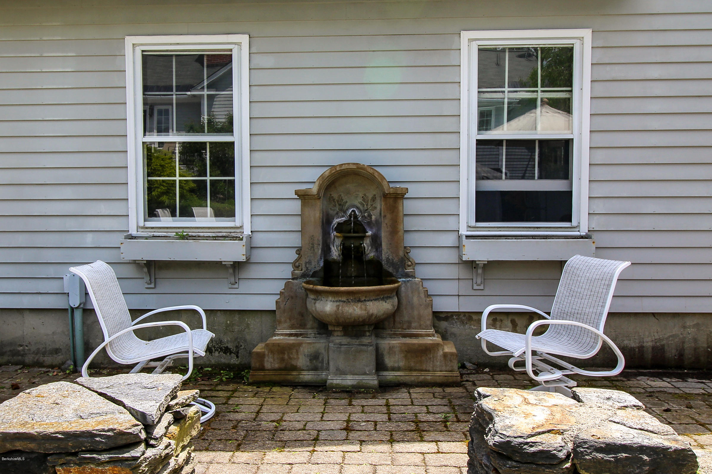 215 Devon Road Lee, MA 01238 - Photo 46 of 59 a front view of a house with patio