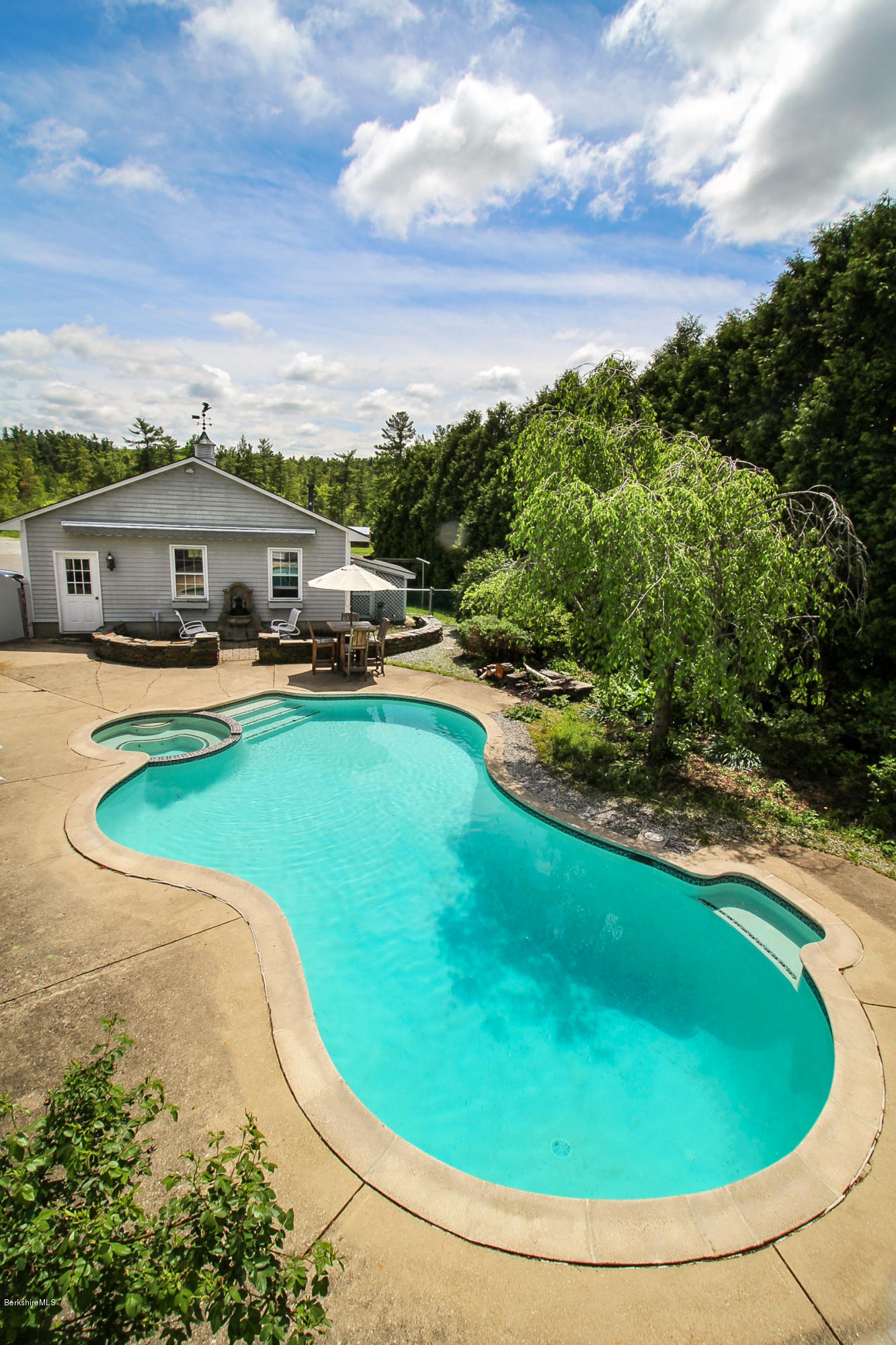 215 Devon Road Lee, MA 01238 - Photo 49 of 59 a view of a swimming pool with a yard
