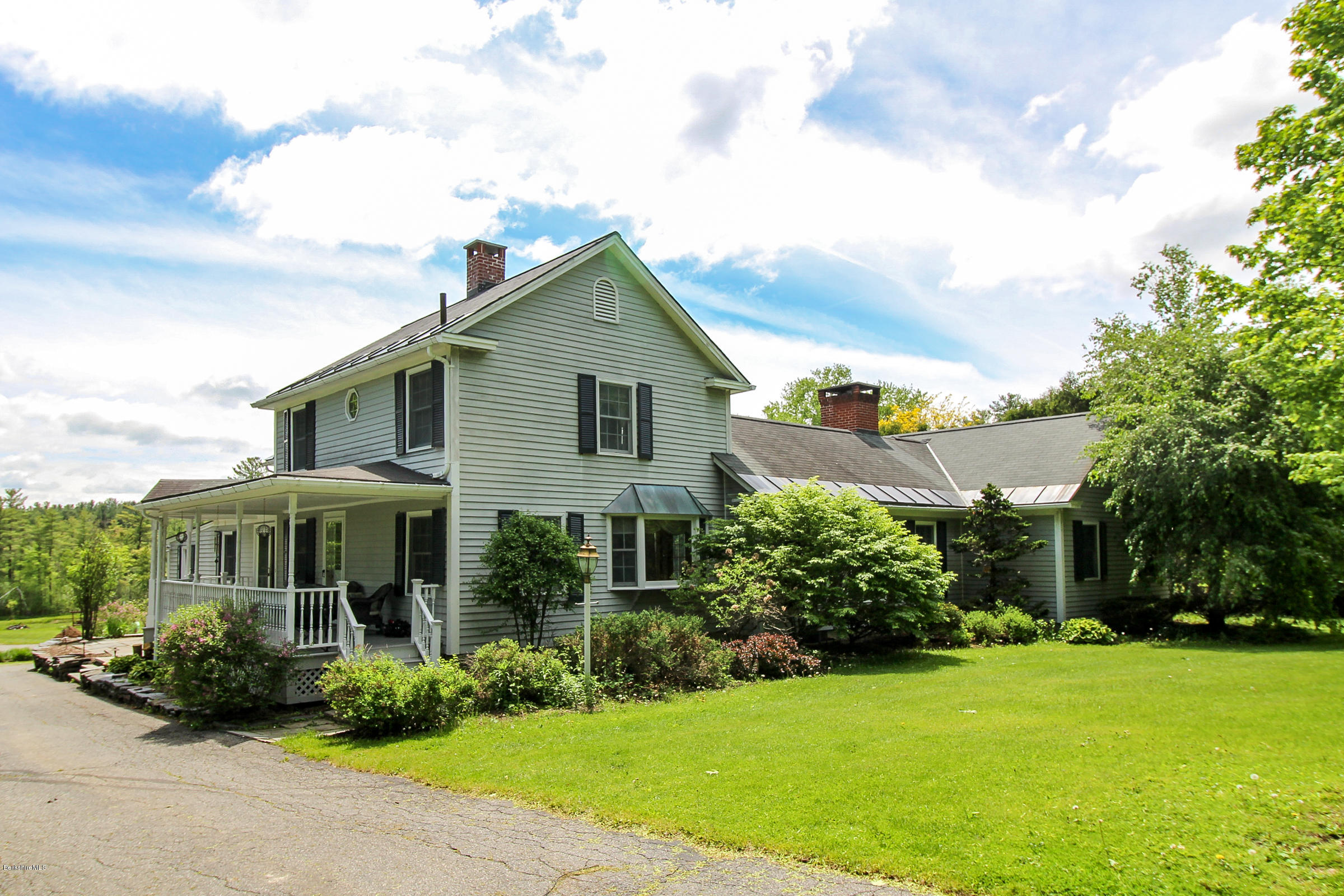 215 Devon Road Lee, MA 01238 - Photo 6 of 59 a front view of a house with a yard