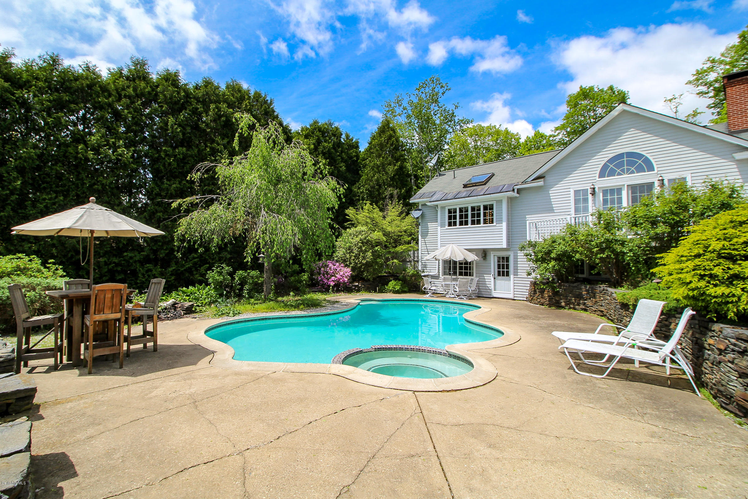 215 Devon Road Lee, MA 01238 - Photo 51 of 59 a view of a house with swimming pool and sitting area