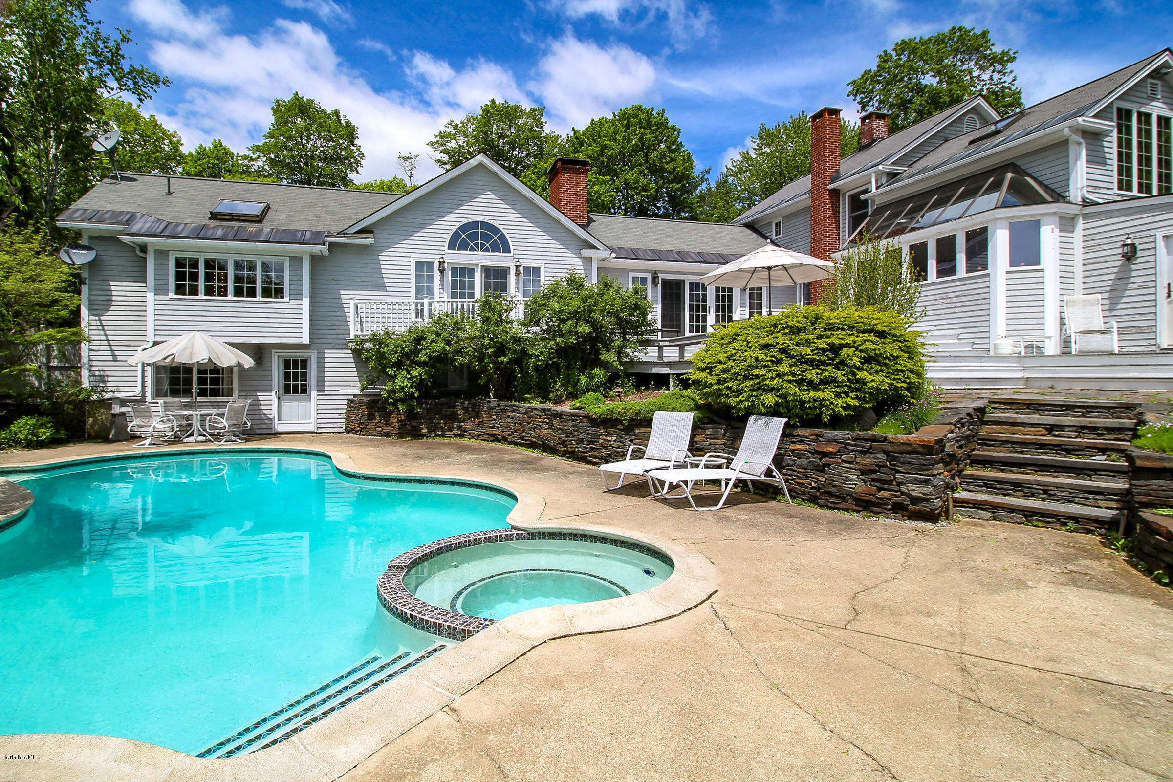 215 Devon Road Lee, MA 01238 - Photo 52 of 59 a front view of a house with swimming pool