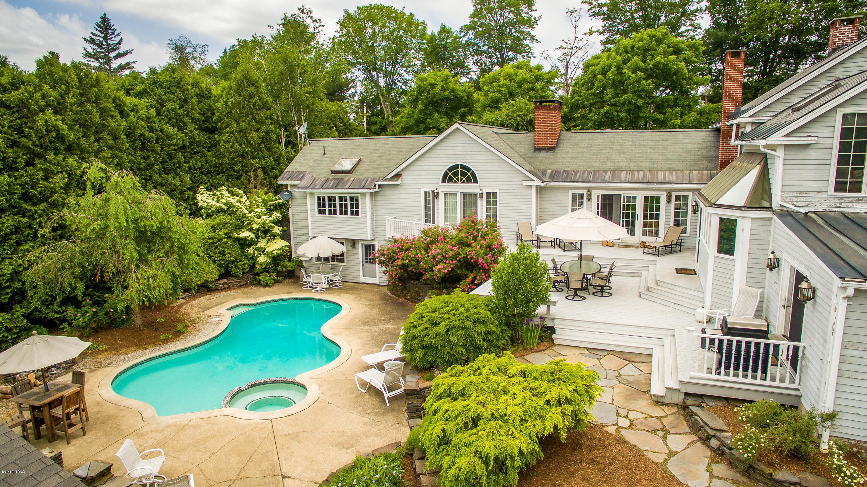 215 Devon Road Lee, MA 01238 - Photo 55 of 59 a front view of a house with a yard