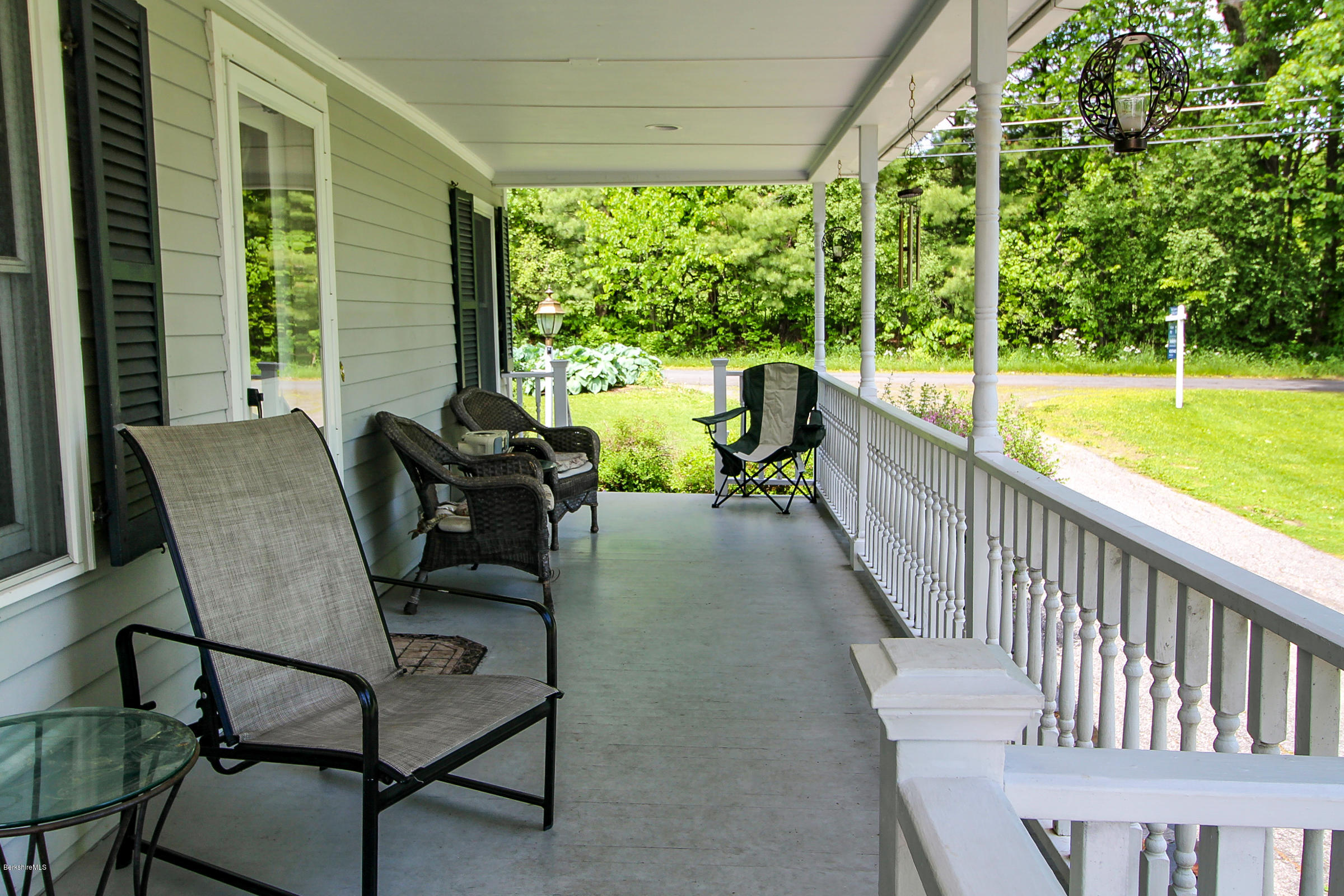 215 Devon Road Lee, MA 01238 - Photo 7 of 59 a view of a two chairs in the balcony