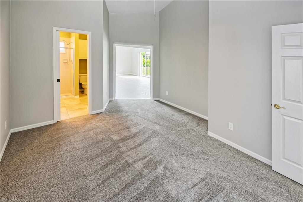 6721 Sloane Place Naples, FL 34104 - Photo 12 of 29 an empty room with a bathroom and sink