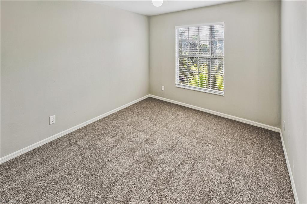 6721 Sloane Place Naples, FL 34104 - Photo 15 of 29 an empty room with a window