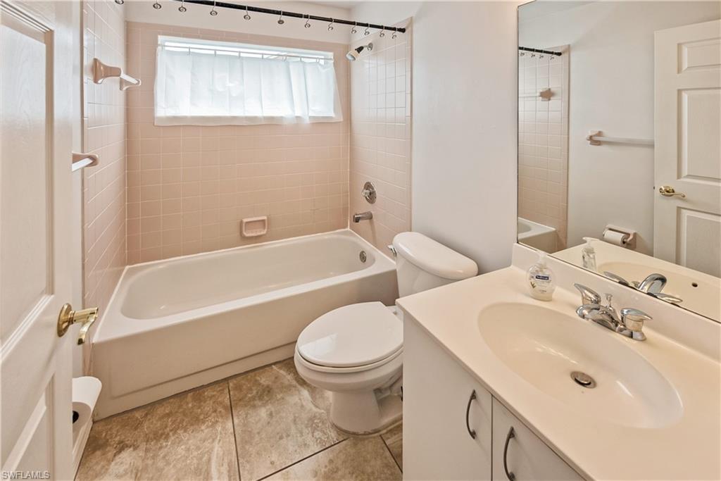 6721 Sloane Place Naples, FL 34104 - Photo 17 of 29 a bathroom with a sink toilet and shower