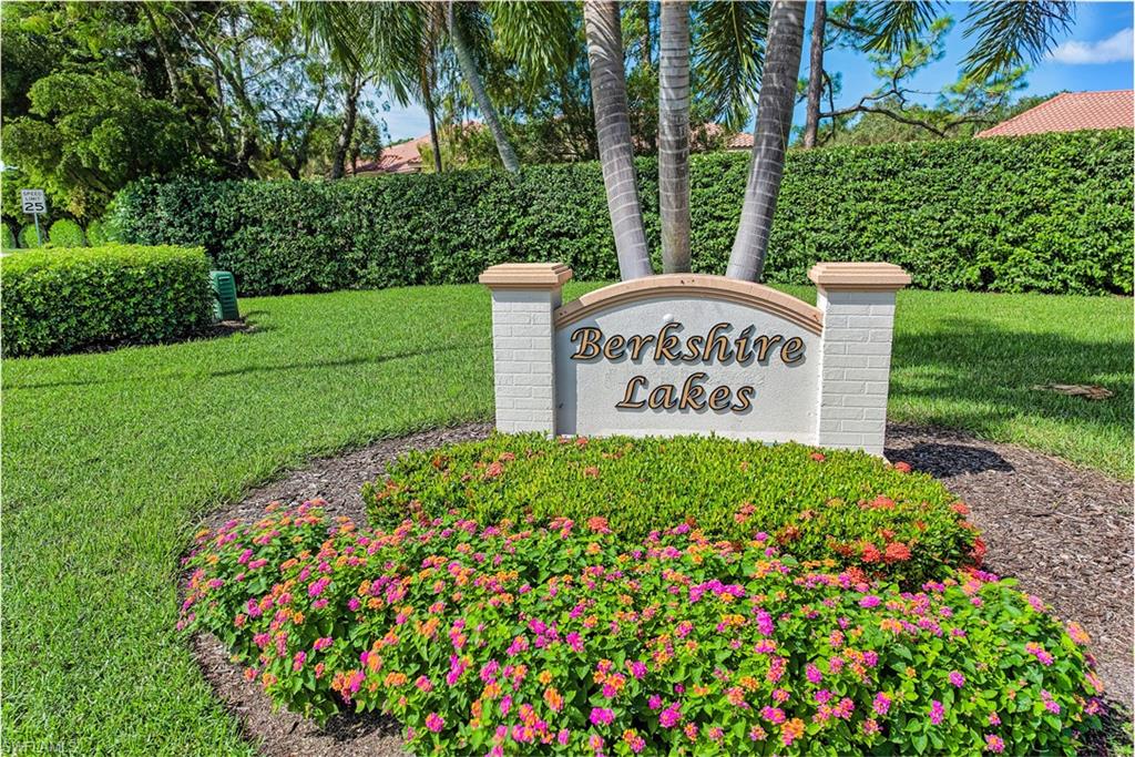 6721 Sloane Place Naples, FL 34104 - Photo 2 of 29 a sign that is sitting in front of a tree