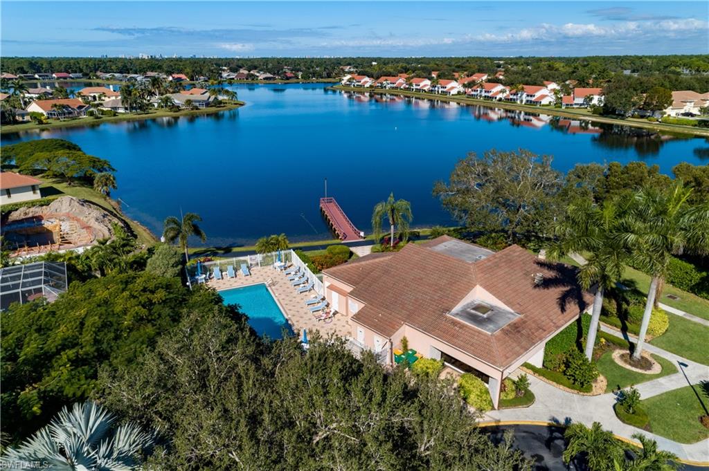 6721 Sloane Place Naples, FL 34104 - Photo 25 of 29 an aerial view of a house with a lake view