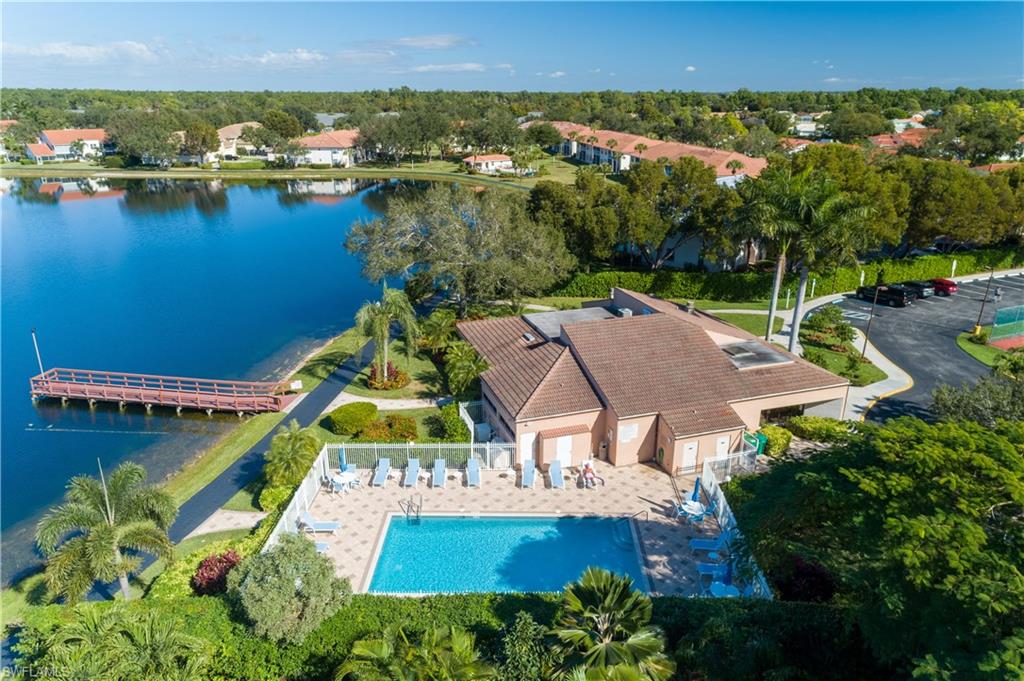 6721 Sloane Place Naples, FL 34104 - Photo 26 of 29 an aerial view of a house with a lake view