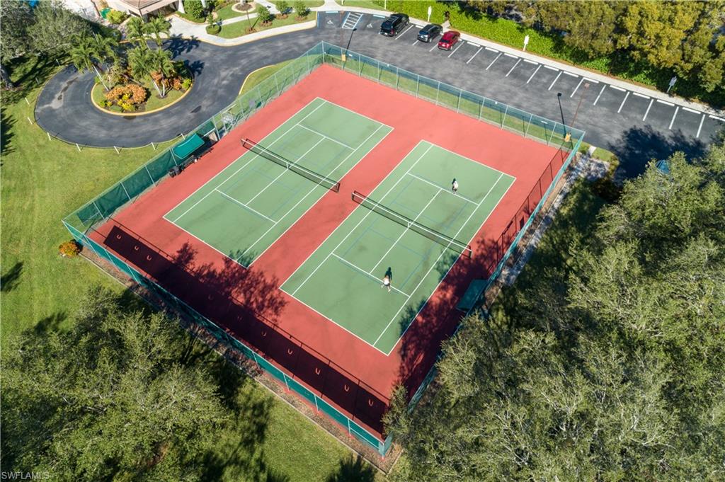 6721 Sloane Place Naples, FL 34104 - Photo 28 of 29 an aerial view of a tennis ground and a yard