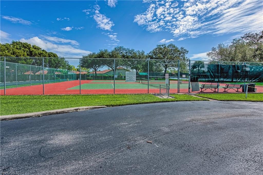 6721 Sloane Place Naples, FL 34104 - Photo 29 of 29 a view of a park with large trees and entertaining space