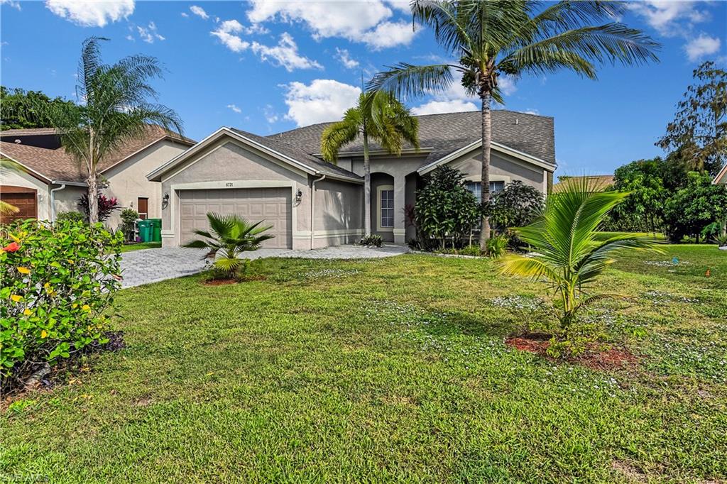 6721 Sloane Place Naples, FL 34104 - Photo 3 of 29 a view of a house with a yard