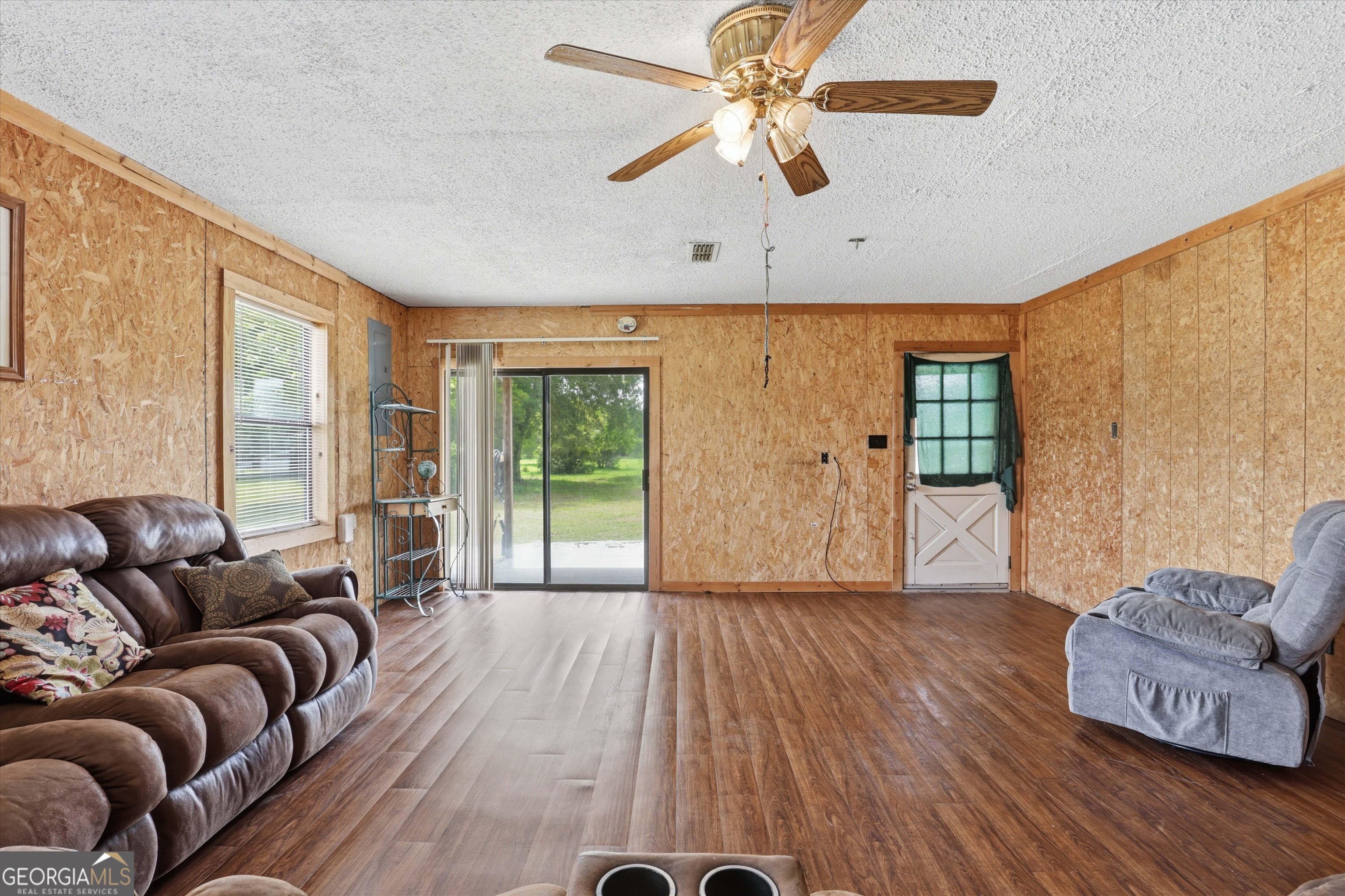 1525 Myron Hart Road Coolidge, GA 31738 - Photo 10 of 58 a living room with furniture and a large window