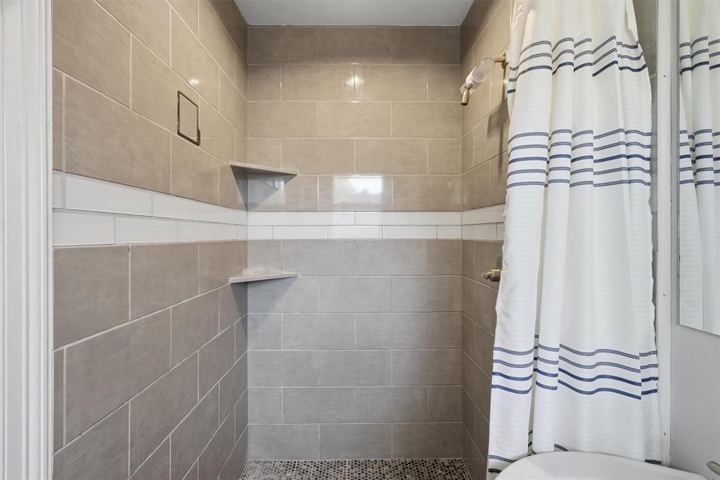 4105 Springbranch Drive Benbrook, TX 76116 - Photo 17 of 27 a bathroom with a shower