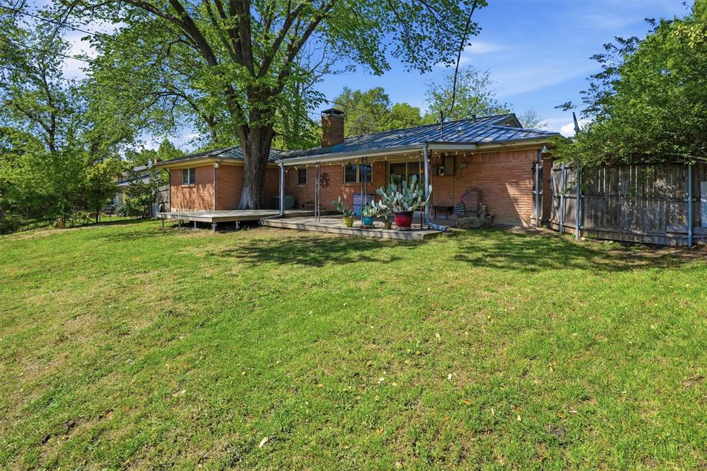 4105 Springbranch Drive Benbrook, TX 76116 - Photo 23 of 27 a view of a house with backyard and sitting area