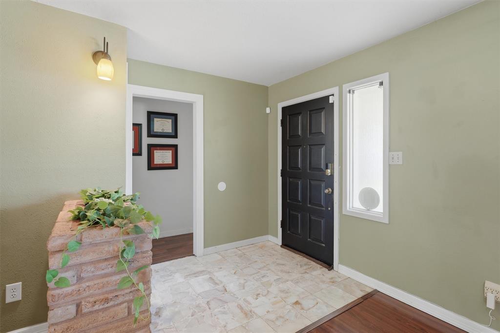4105 Springbranch Drive Benbrook, TX 76116 - Photo 4 of 27 a view of entryway with wooden floor