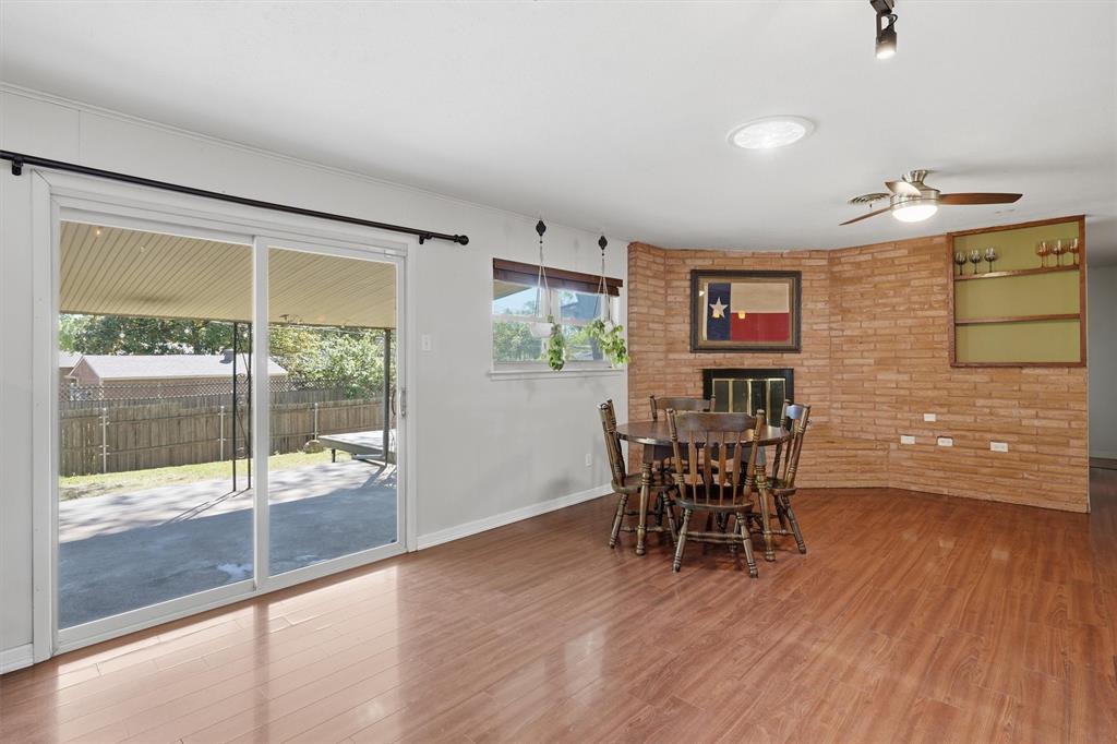 4105 Springbranch Drive Benbrook, TX 76116 - Photo 10 of 27 a dining room with furniture and wooden floor