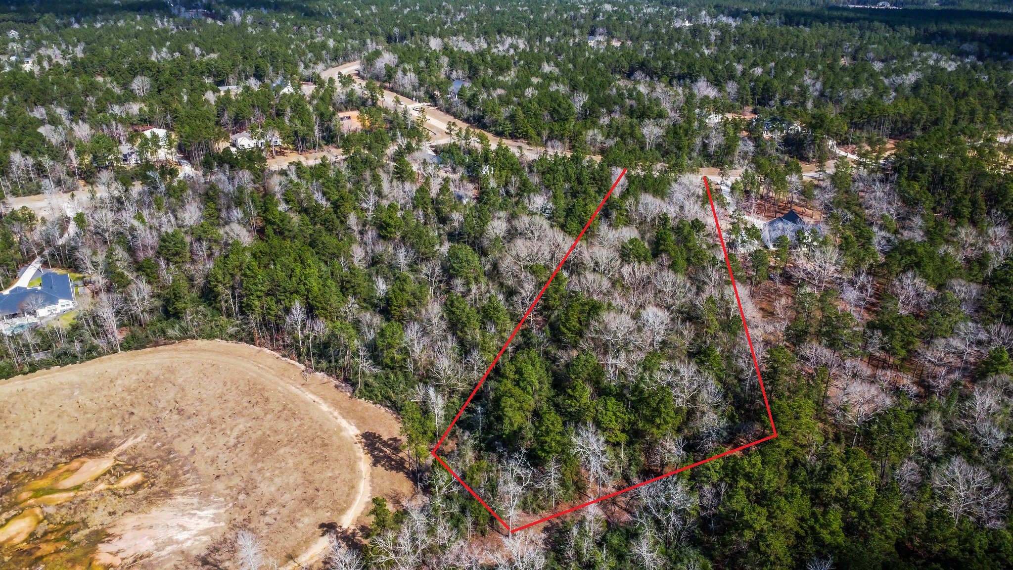 15491 Red Hawk Road Willis, TX 77378 - Photo 2 of 20 a view of a yard