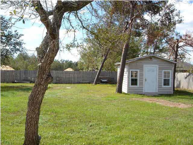 2797 Augustus Road Navarre, FL 32566 - Photo 3 of 7 Additional storage space located in backyard