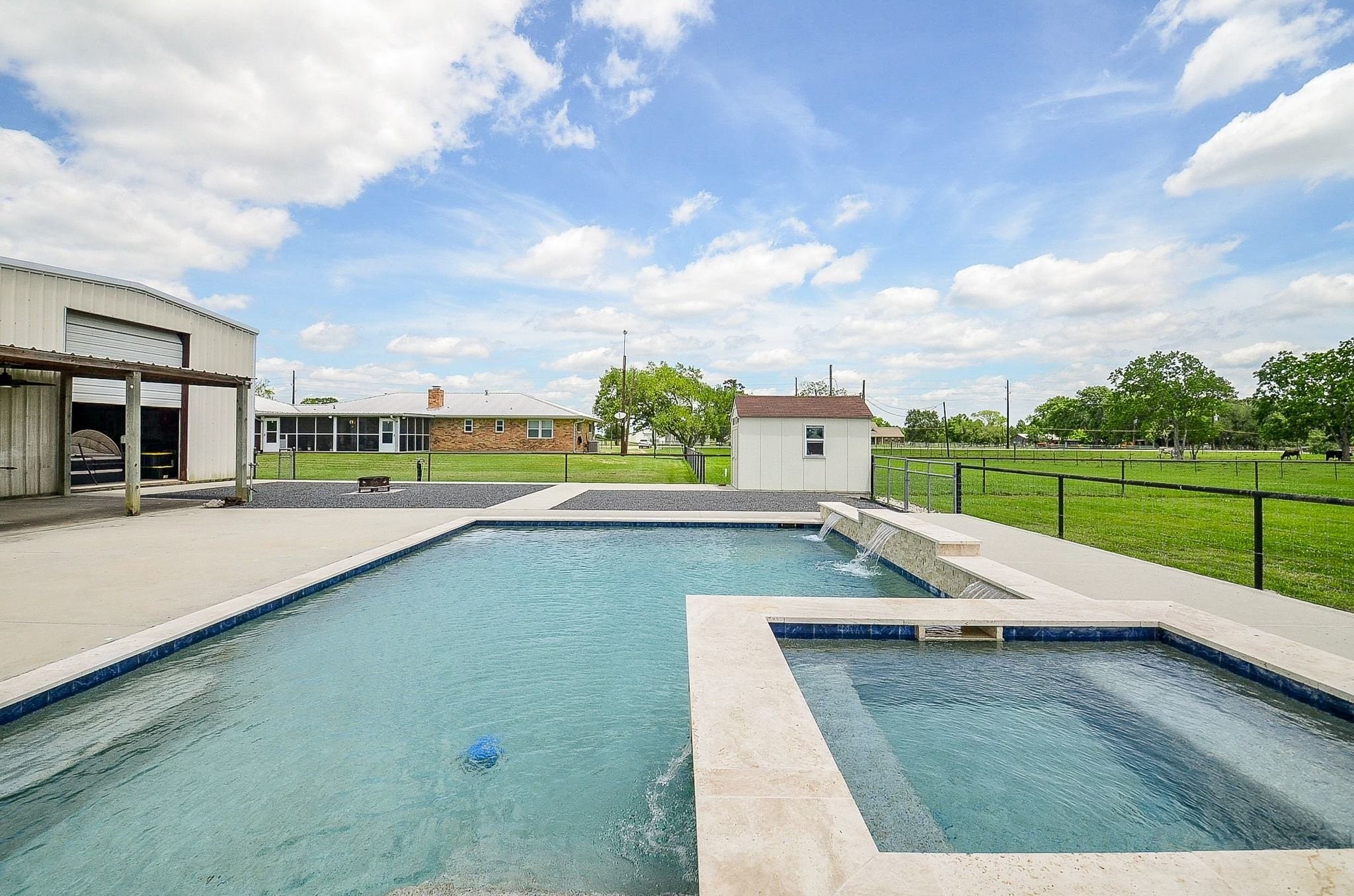 2500 County Road 62 Rosharon, TX 77583 - Photo 33 of 48 a view of a swimming pool with a lounge chairs