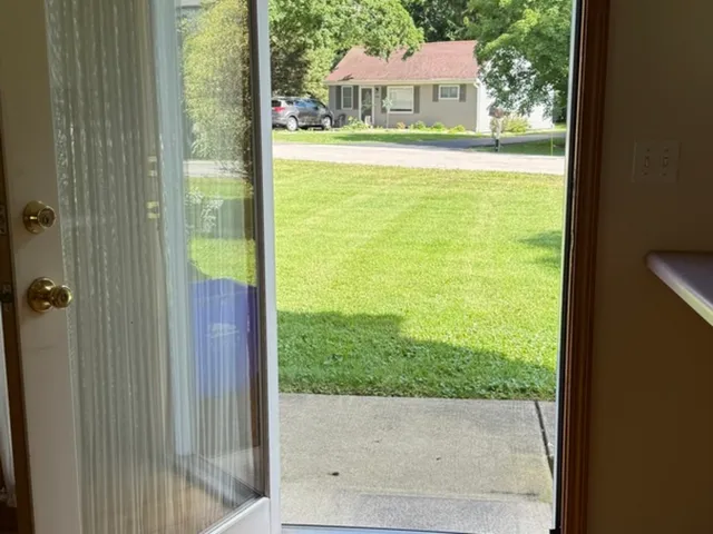 a view of a patio and a yard