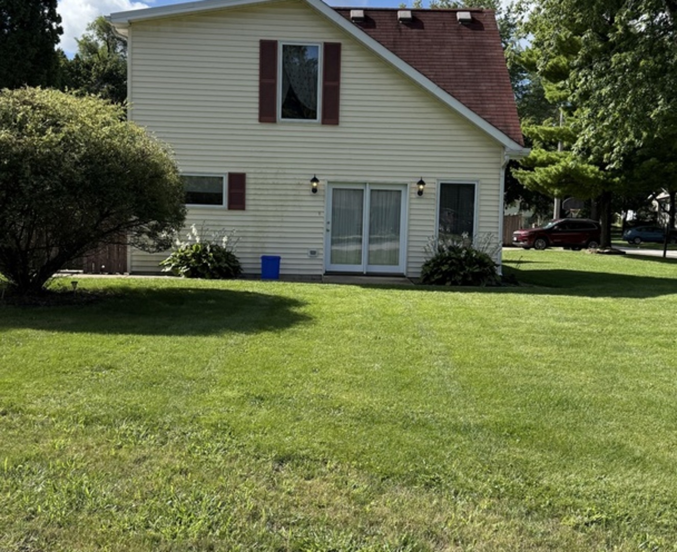 125 Maple Court, Unit 1 Geneva, IL 60134 - Photo 18 of 18 a view of a house with a yard