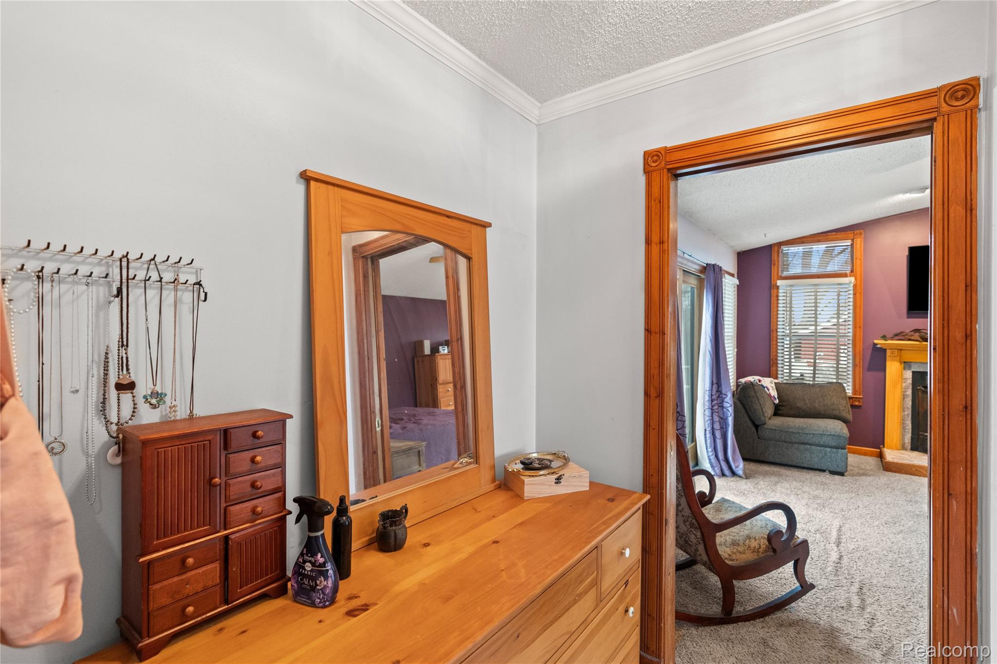 6076 East Carpenter Road Flint, MI 48506 - Photo 29 of 67 Hall with a textured ceiling, carpet floors, and crown molding