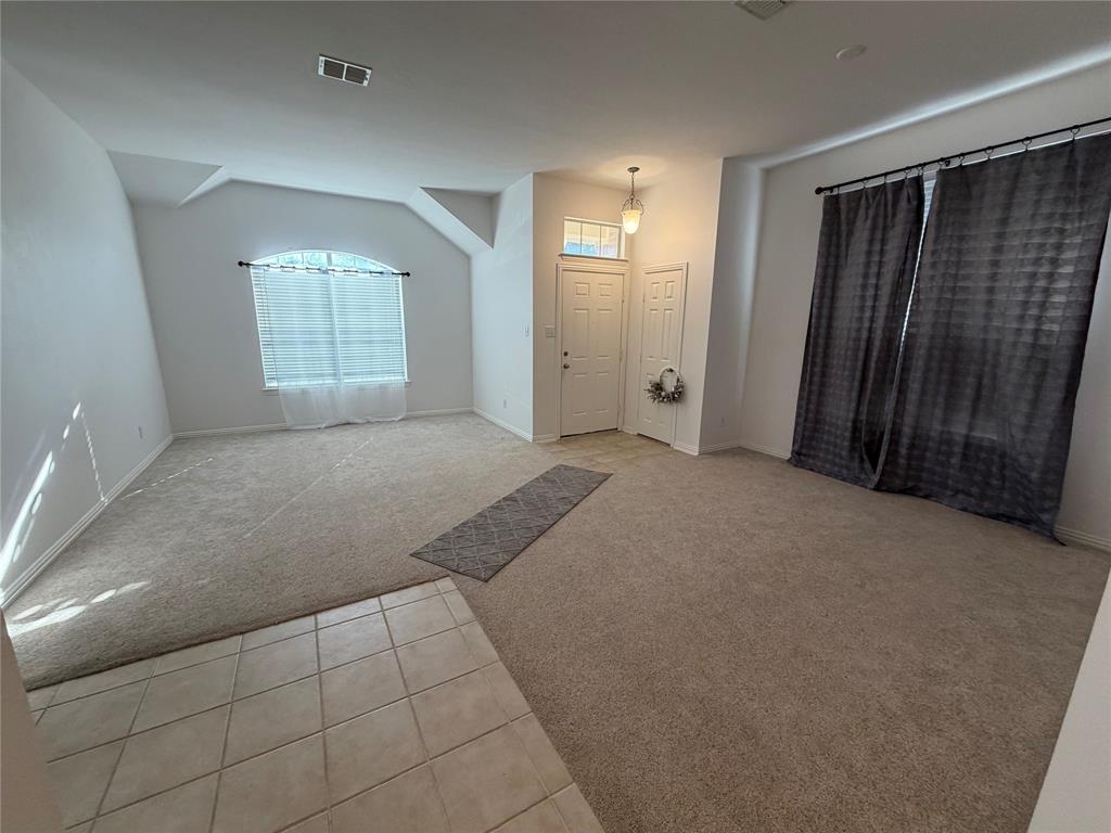 4618 Island Bay Drive Arlington, TX 76119 - Photo 4 of 16 an empty room with windows