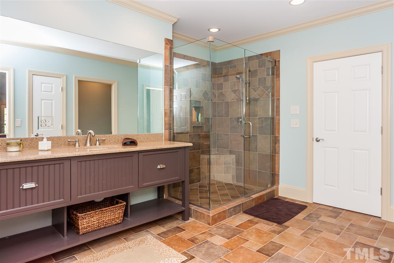 1807 Chester Road Raleigh, NC 27608 - Photo 22 of 25 a bathroom with a double vanity sink mirror and shower