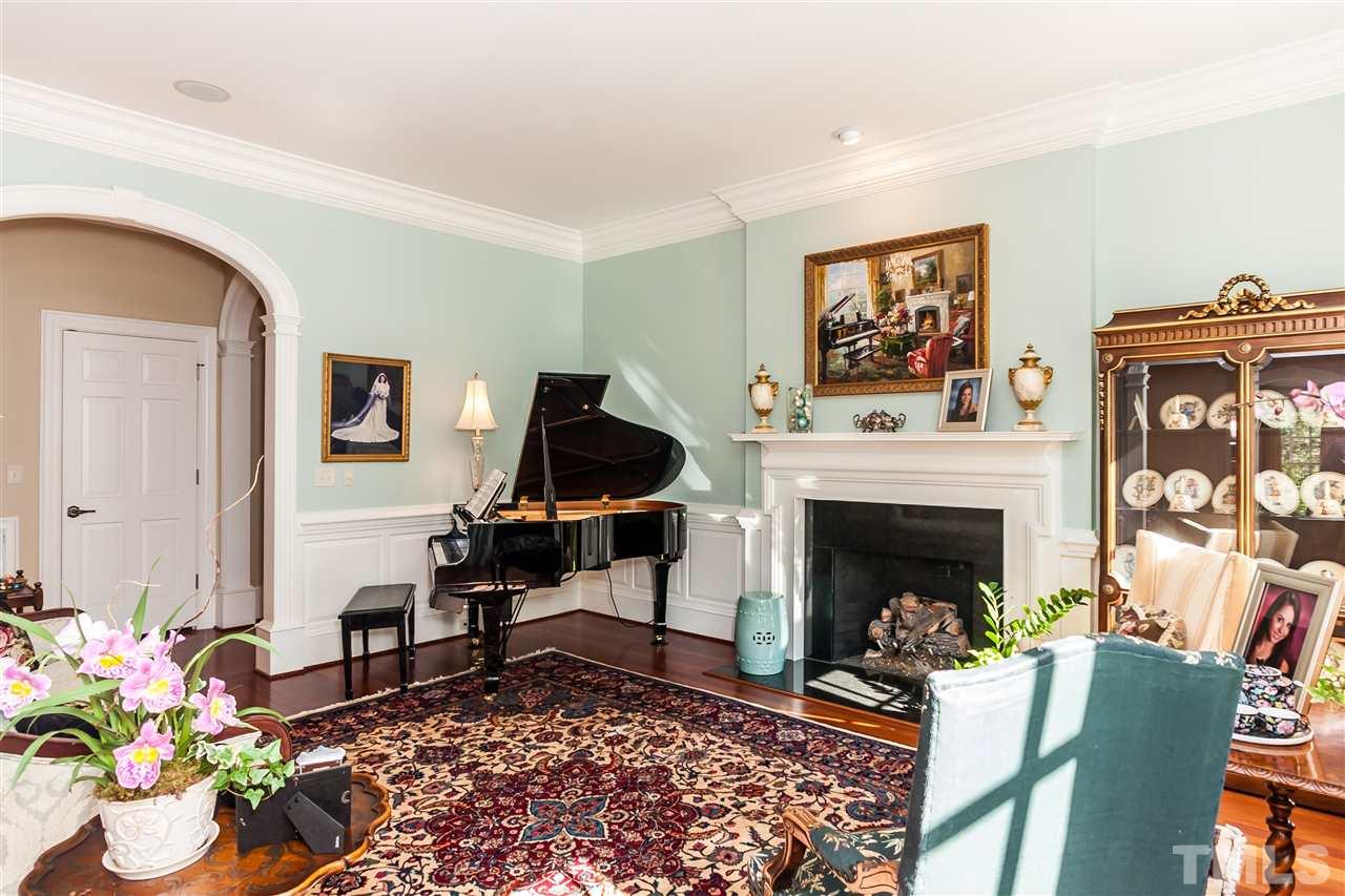 1807 Chester Road Raleigh, NC 27608 - Photo 5 of 25 a living room with furniture a fireplace and a potted plant